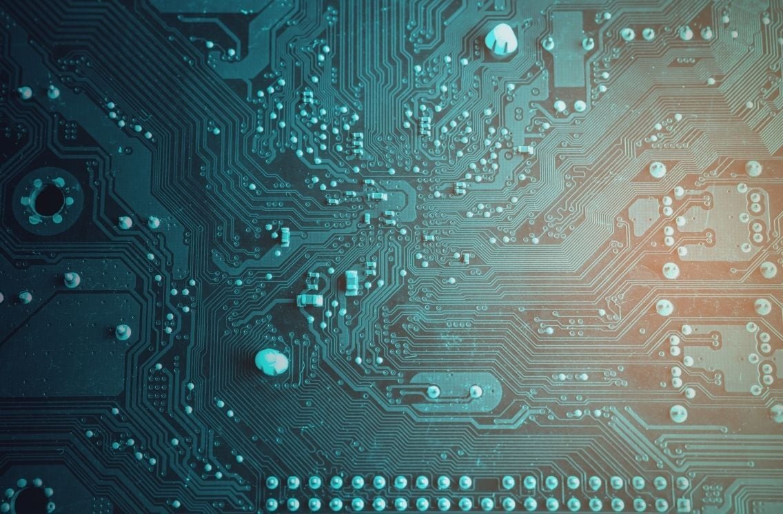 Close-up view of a digital circuit board, symbolizing the complex technology infrastructure behind modern healthcare IT systems.