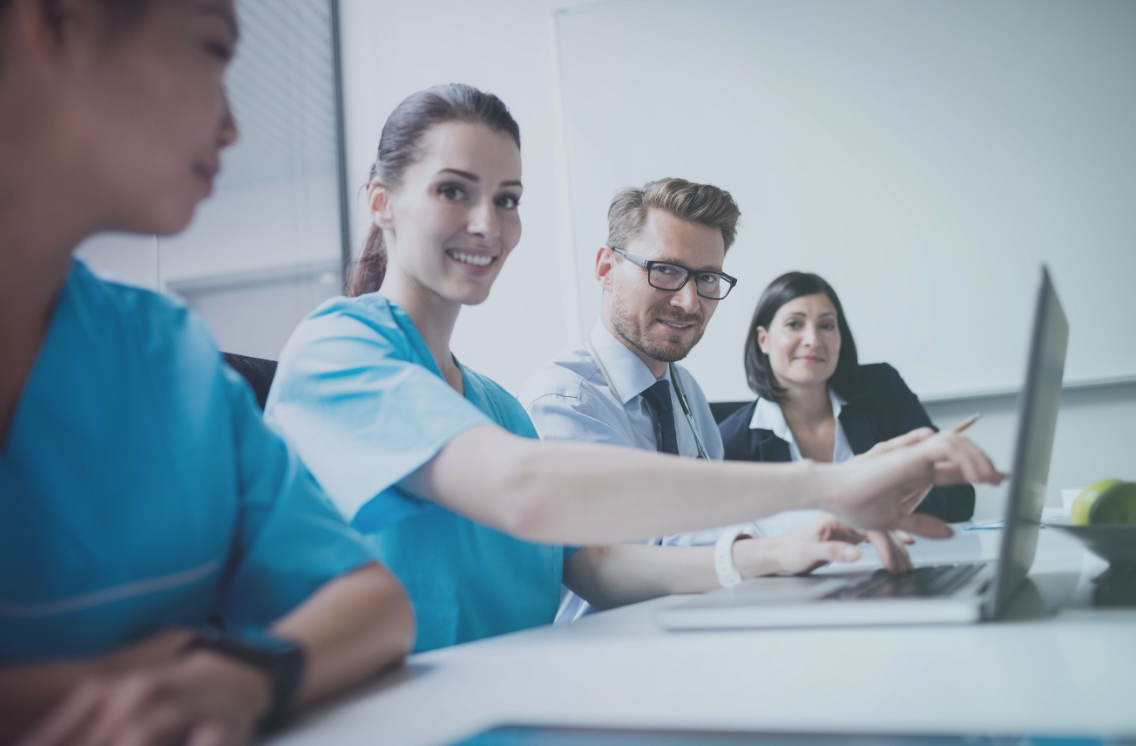 Healthcare HR professionals reviewing the nursing recruitment process to hire and retain nurses.